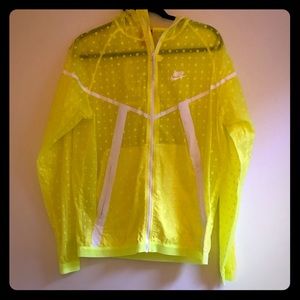 Yellow Nike running jacket with white polka dots